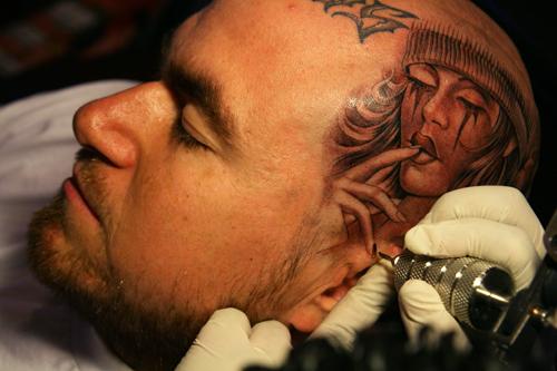 Head tattoo done by Jose Lopez located in California at Lowrider Tattoo 